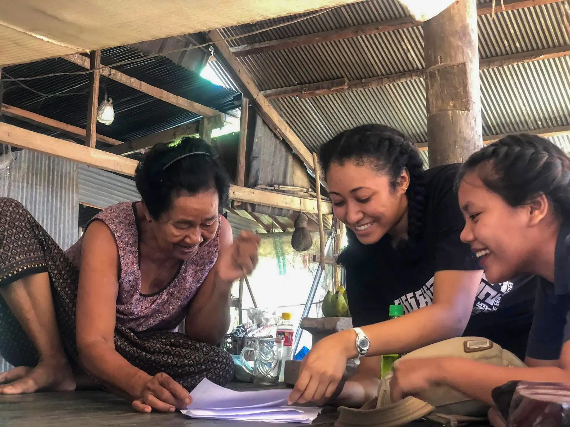 Photo of SOMD students helping an auntie