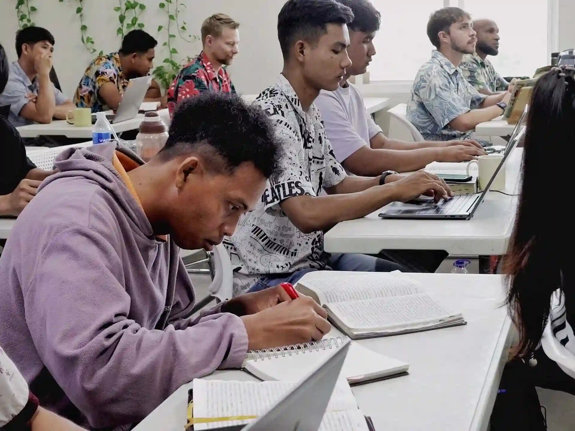 Photo of students taking notes in SBS